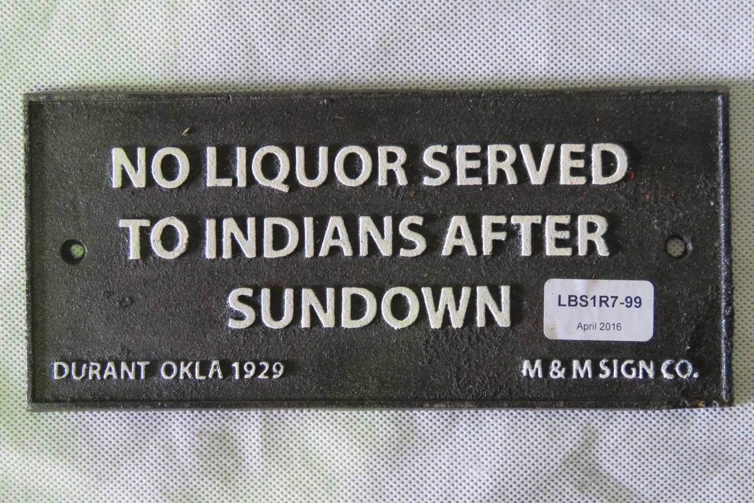 A cast metal sign 'No Liquor Served to I