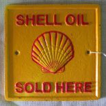 A square shaped 'Shell Oil Sold Here' si