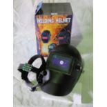 An auto darkening welding helmet with we