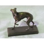 A cast bronze effect greyhound figurine