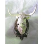 A cast metal bulls head with nose ring