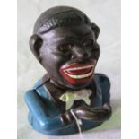 A contemporary cast metal 'Jolly Nigger'