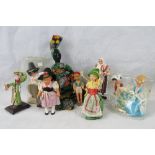 Nine tourist dolls each dressed in tradi