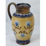 A Doulton Stoneware jug with pewter lid,