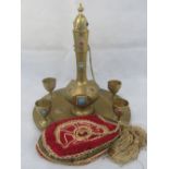 A Middle Eastern brass tray decorated wi