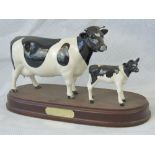 A Beswick 'Friesian Cow and Calf' figure