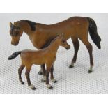 A cast metal cold painted mare and foal