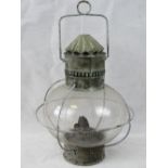 A vintage glazed storm oil lamp in origi