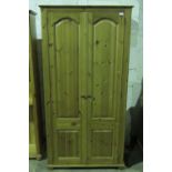 An contemporary two door pine wardrobe m