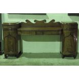 A late Georgian sideboard comprising cen