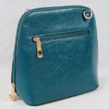 Handbag. Sea green, shoulder strap, zip closure, two internal zip pockets. 22cm wide.