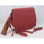 Handbag. Red with woven/tassel design, shoulder strap, internal zip pocket and internal open pocket.