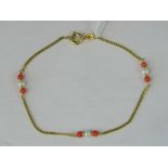 A 14ct gold pearl and coral bracelet,