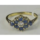 An 18ct gold sapphire and diamond cluster ring, diamond shaped cluster of eight sapphires,