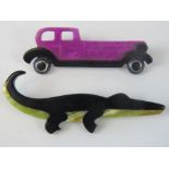 Two Lea Stein brooches, a black and green crocodile and a pink and black Rolls Royce.