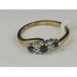 A 9ct gold diamond and sapphire ring,
