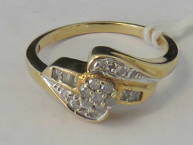 A 10ct gold and diamond twist design ring,