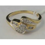 A 10ct gold and diamond twist design ring,