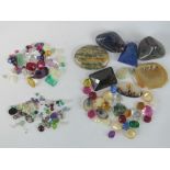 A quantity of loose semi precious and paste stones including rubies, sapphires etc.