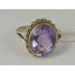 A 9ct gold amethyst ring, large oval amethyst approx 4cts in twisted rope setting,