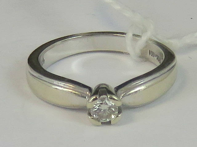 A 14ct white gold and diamond solitaire ring, approx 0.15ct, stamped 14k Mex, size I, 3.