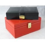 Two leatherette jewellery caskets.