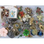 Costume jewellery; collection of 20thC brooches depicting floral arrangements,