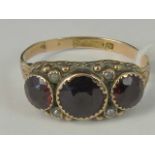 A high Victorian 9ct gold garnet and seed pearl ring,