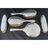 A HM silver five piece dressing table set comprising two hair brushes,