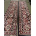 A fine pair of antique blue ground woollen runners having geometric design upon and each measuring