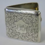 A HM silver cigarette case with floral engraved design, wire spring strap marked Hill Shenstone,