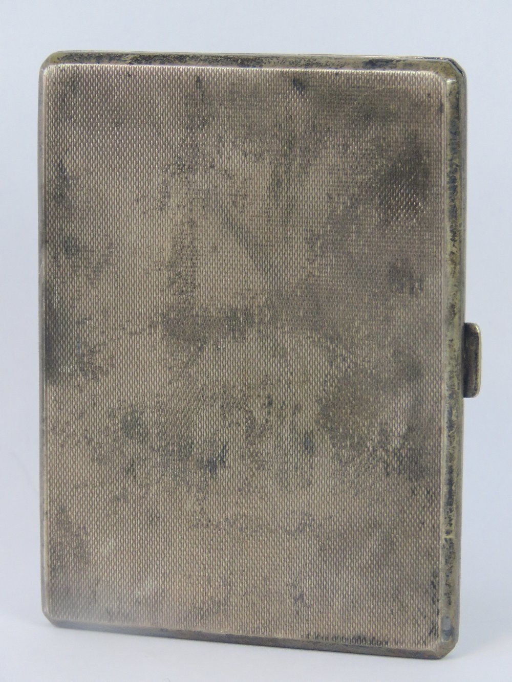 A HM silver cigarette case, elastic in good condition, Birmingham 1945, maker Adie Brothers,