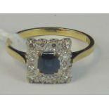 An 18ct gold sapphire and diamond ring, central square cut Ceylon blue sapphire approx 0.