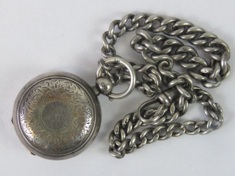 A HM silver sovereign case engraved with floral pattern,