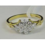 An 18ct gold diamond cluster ring, a diamond shaped cluster of diamonds set in white metal,