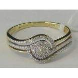 A 9ct gold diamond encrusted twist design ring,