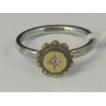 A silver and yellow metal ring,