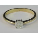 A 9ct gold and diamond solitaire ring, 0.25ct diamond claw set in yellow metal, hallmarked 375, 1.