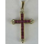 A 9ct gold ruby and diamond cross pendant,