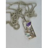 A silver Rennie Mackintosh style pendant set with teardrop aquamarine and amethyst, stamped 925, 2.