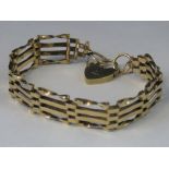 A 9ct gold four bar gate bracelet with hallmarked heart clasp, 10.