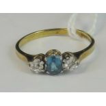 A 9ct gold topaz and diamond ring, central oval topaz approx 0.