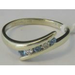 A 9ct gold diamond and aquamarine twist style ring,