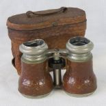 A pair of vintage "Jockey Club- Paris" binoculars with leather grips and original case; a/f.