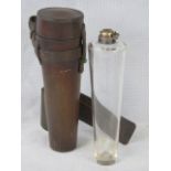 A conical glass flask in leather saddle case, top AF. 22cm high.