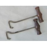 A pair of pig-skin handled boot pulls.