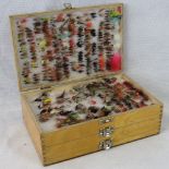 A three- tier 'Bob Church & Co' fly box containing around 1000 flies as tied and uses by Bob Church