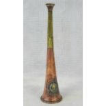 A copper and brass hunting horn by Thomas Brown and dated 1920 and standing 23vm high.