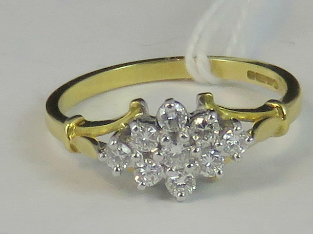 An 18ct gold diamond cluster ring, a dia