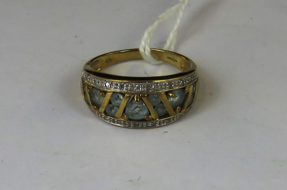 A 9ct gold aquamarine and diamond ring,